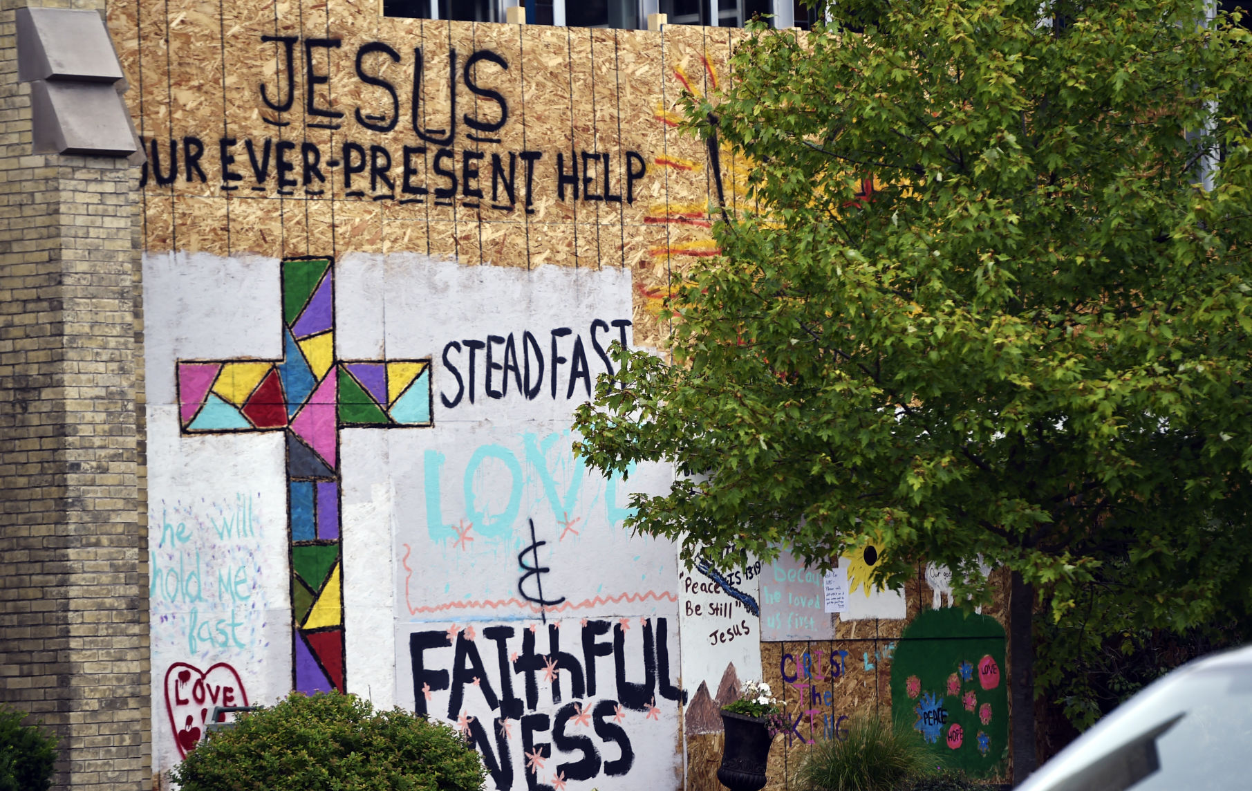 Art painted on the boarded up walls of Kenosha's Christ The King Church